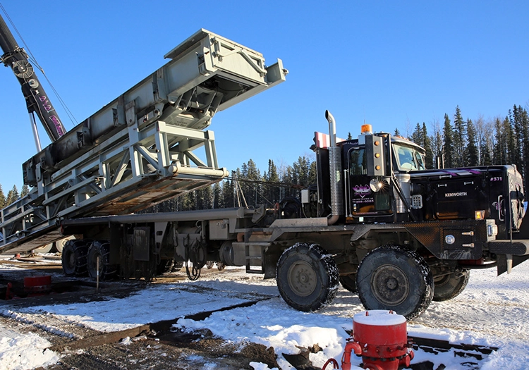 Large truck dropping off a heavy load