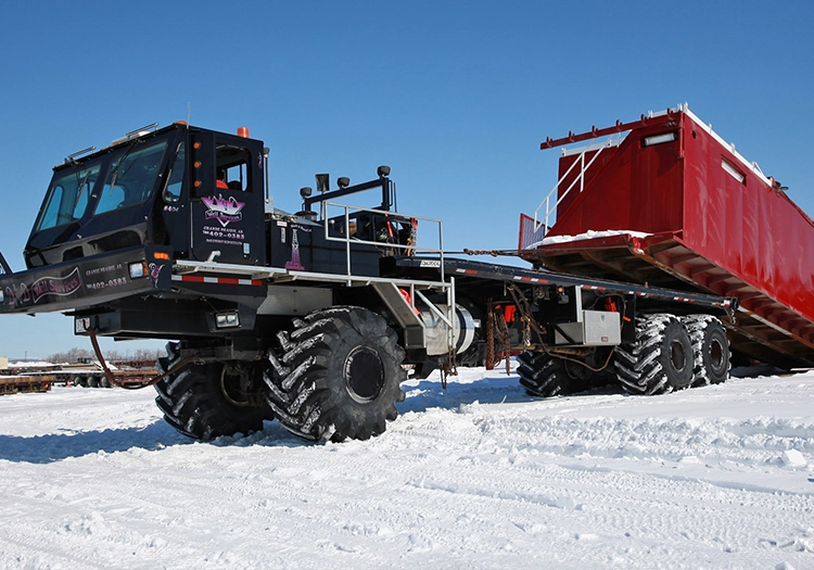 Large truck dropping off a heavy load