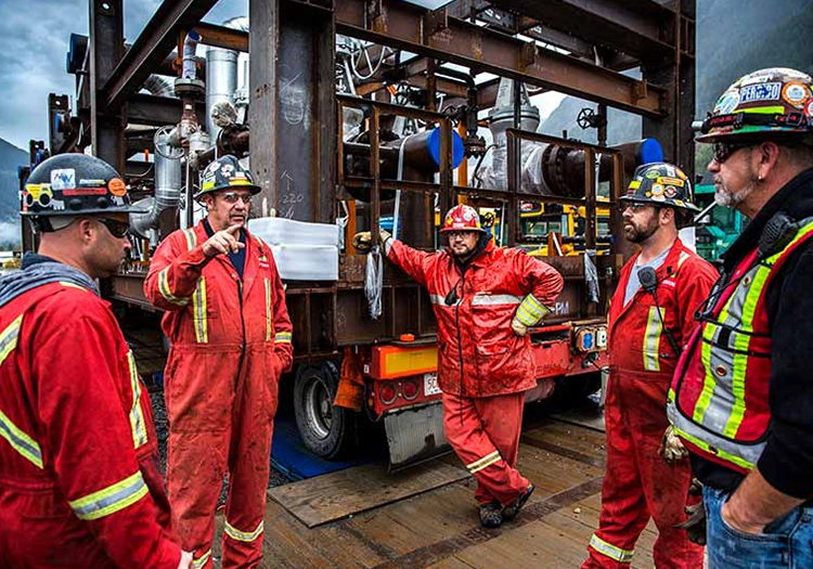 Group of employees in coveralls