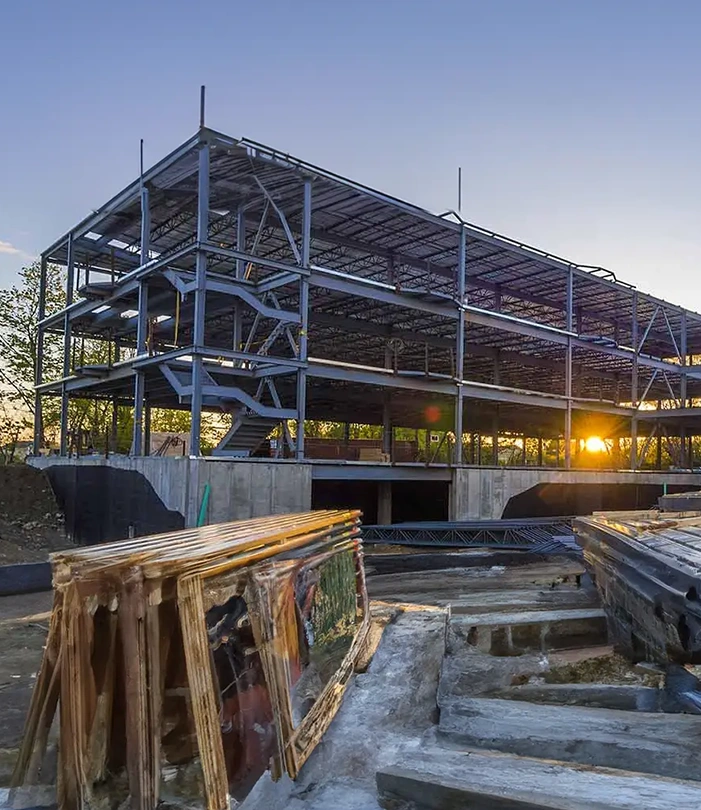 Large framed building with sunset