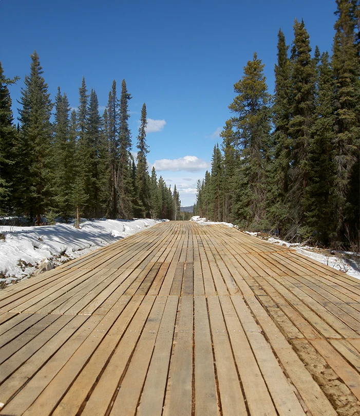 Wooden mats forming a makeshift road for trucks